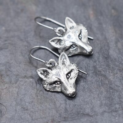 Handmade-silver-fox-head-dangle-earrings-on-white-background