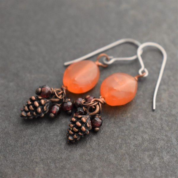 Orange carnelian Earrings with dangle copper pine cones, red garnet gemstones