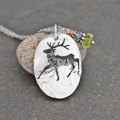 a elk pendant with gemstone charm