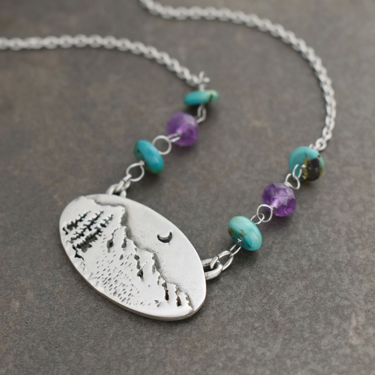 Oval Mountain Pendant with blue turquoise and amethyst Oval Mountain Pendant with blue turquoise and amethyst