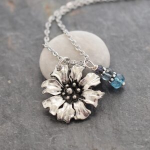 Handmade Cornflower pendant with blue topaz gemstones on a 18' inch stainless steel chain.