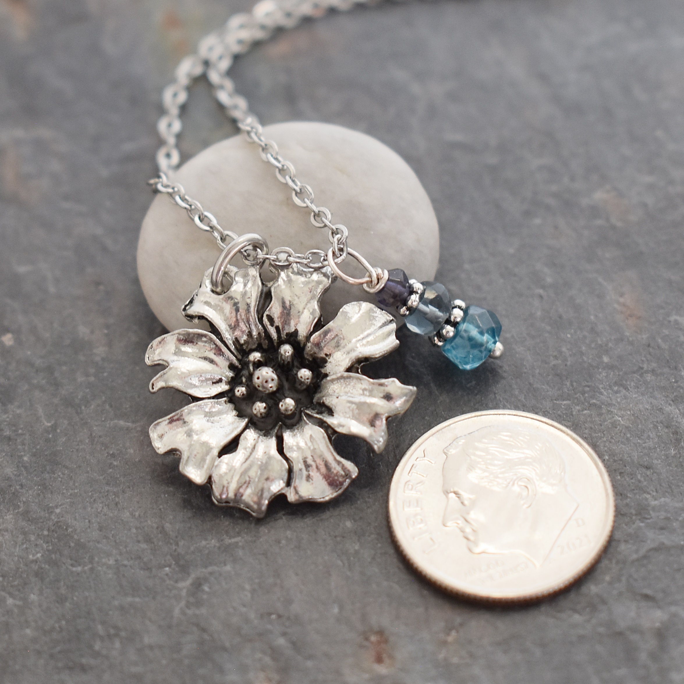 Handmade Cornflower pendant with blue topaz gemstones on a 18' inch stainless steel chain.