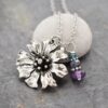 Purple amethyst gemstone Cornflower Necklace wildharegems Handmade Cornflower pendant with purple amethyst gemstones on a 18' inch stainless steel chain.