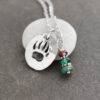 Bear print with garnet, green quartz, turquoise Bear print with garnet, green quartz, turquoise