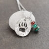 Bear print with garnet, green quartz, turquoise Bear print with garnet, green quartz, turquoise