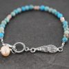 Seashell bracelet with turquoise and peach gemstones