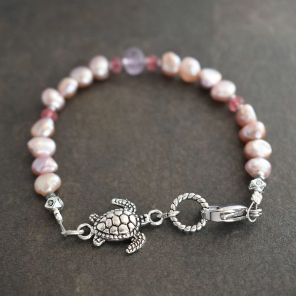 Sea Turtle Bracelet with Pink Pearls "Handmade Sea Turtle Bracelet with Pink Pearls and Amethyst Gemstones."
