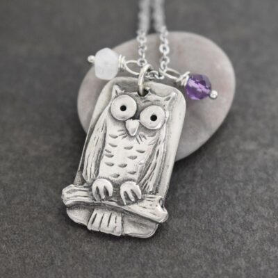 silver owl with white moonstone and purple amethyst gemstones