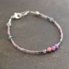 Thin lavender purple beads with lager pink lavender gemstones