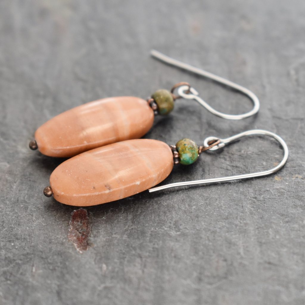 green brown small stone with long oval peach stone earrings