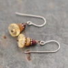 brown and golden gemstone earrings
