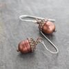 Copper acorn cranberry pearl earrings Copper acorn top on a cranberry pearl earrings