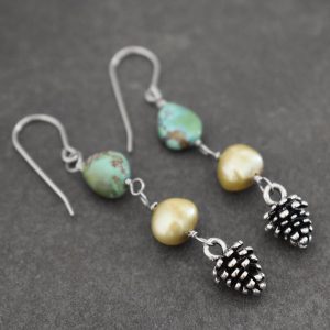 Long turquoise chunk and green pearl with silver pine cone earrings