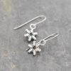 Tiny sliver snowflake earrings