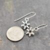 Tiny sliver snowflake earrings