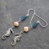 Seahorse pearl topaz earrings (1) Seahorse pearl topaz earrings (1)