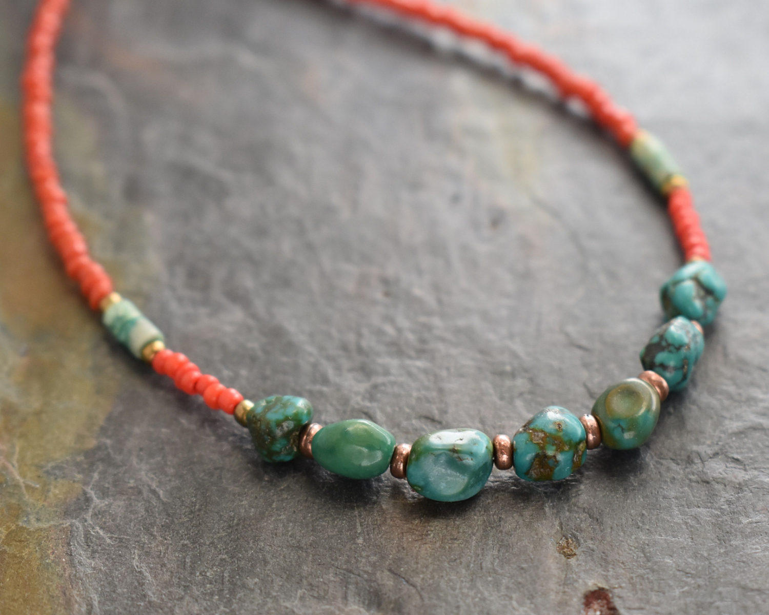 Beaded necklace with red coral dainty beads and turquoise nugget with copper spears beads.
