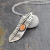 Silver Red-tailed hawk feather necklace Silver Red-tailed hawk feather pendant with orange spiney oyster shell.