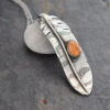 Silver Red-tailed hawk feather necklace with orange spiney oyster Silver Red-tailed hawk feather pendant with orange spiney oyster shell.