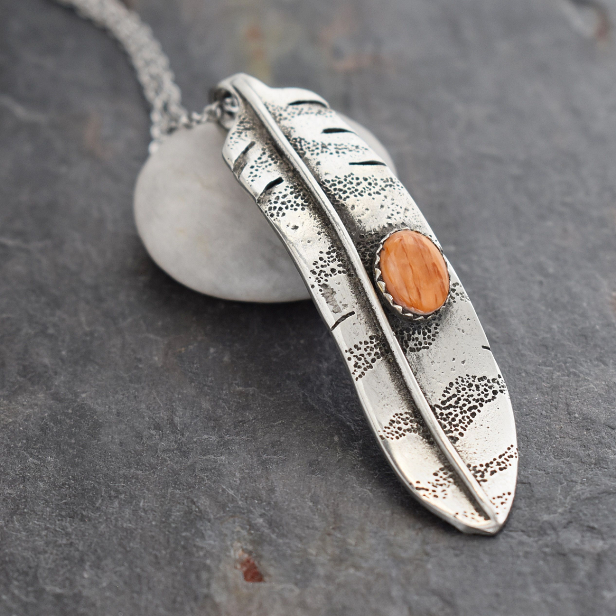 Silver Red-tailed hawk feather pendant with orange spiney oyster shell.