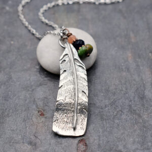 Handmade turkey feather charm necklace with natural sunstone, iolite and turquoise gemstones