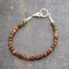 beaded bracelet with brown rusty red and grays gemstones