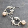 Dolphins and blush pink pearl earrings (3) Dolphins and blush pink pearl earrings (3)