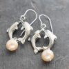 Dolphins and blush pink pearl earrings (4) Dolphins and blush pink pearl earrings (4)