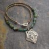 Beaded Timber Wolf Necklace Beaded necklace with turquoise and green aventurine gemstone with silver wolf face