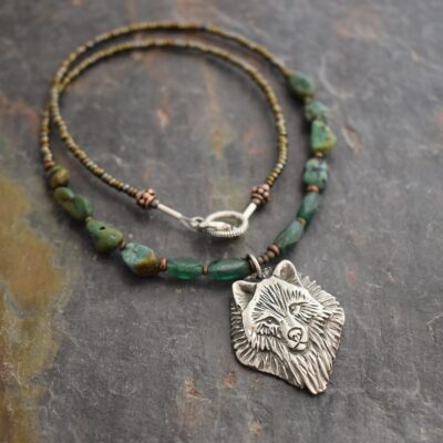 Beaded Timber Wolf Necklace Beaded necklace with turquoise and green aventurine gemstone with silver wolf face