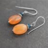 Dangle Tearl jade and orange carnelain gemstone earrings (1) Dangle Tearl jade and orange carnelain gemstone earrings (1)