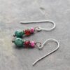 Natral ruby, garnet, turquoise earrings (4) "Handmade gemstone earrings featuring faceted pink ruby, red garnet, and turquoise beads, copper spacers on silver wires."