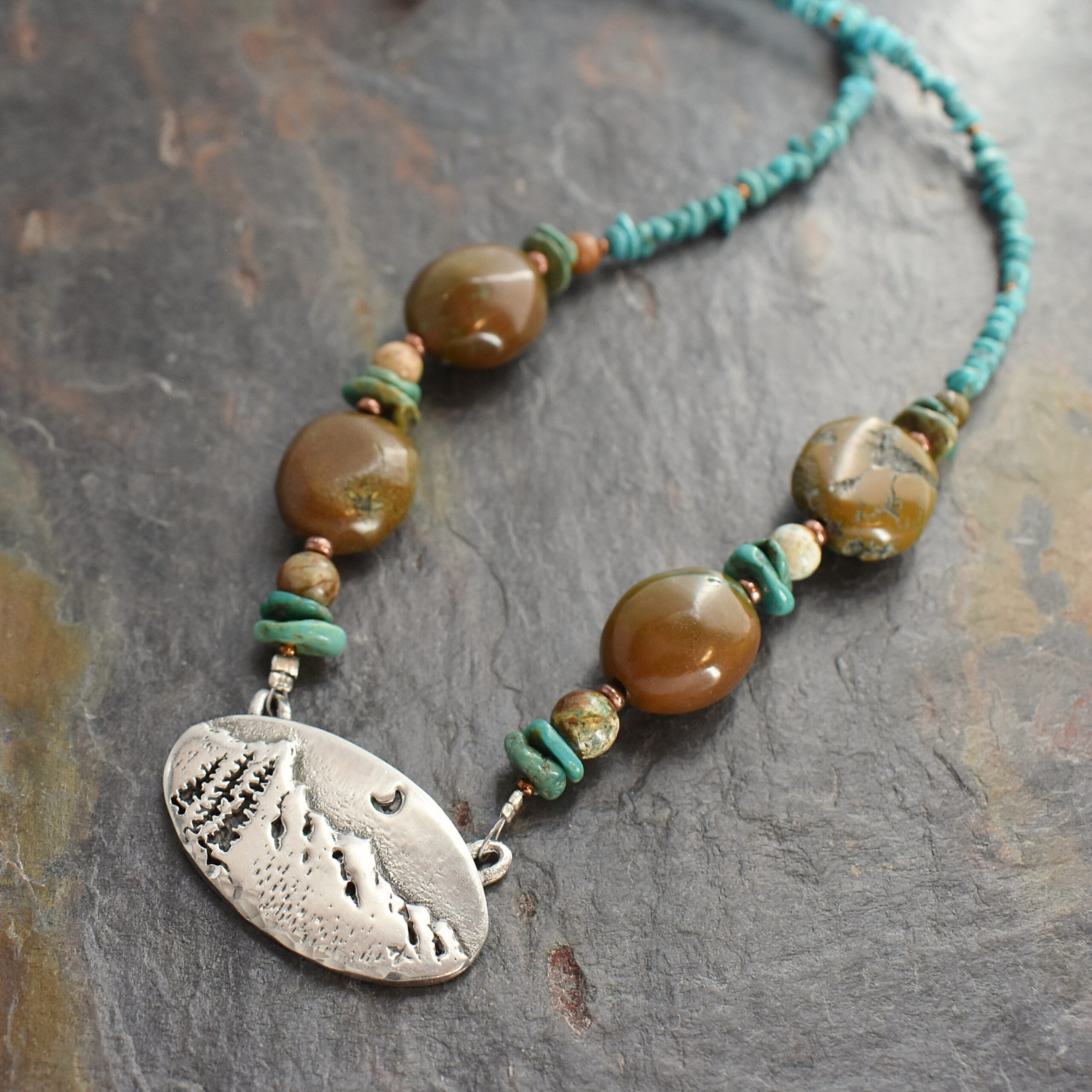 beaded blue and brown turquoise chunky gemstone necklace with a silver pewter mountain pendant