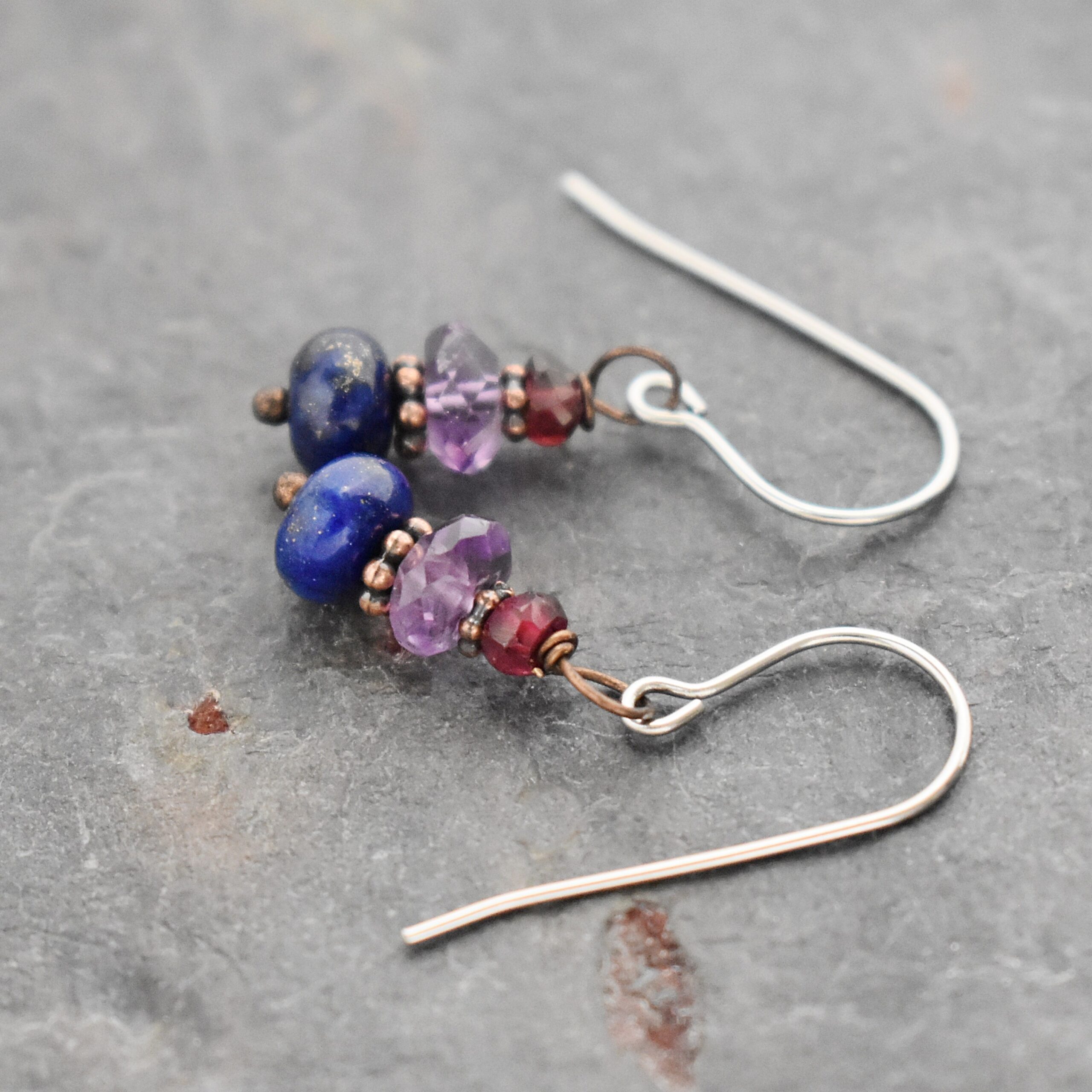 Garnet, Amethyst, Lapis Earrings Handmade gemstone earrings with garnet, purple amethyst and blue lapis stone with copper spacers.