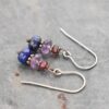Handmade gemstone earrings with garnet, purple amethyst and blue lapis stone with copper spacers.