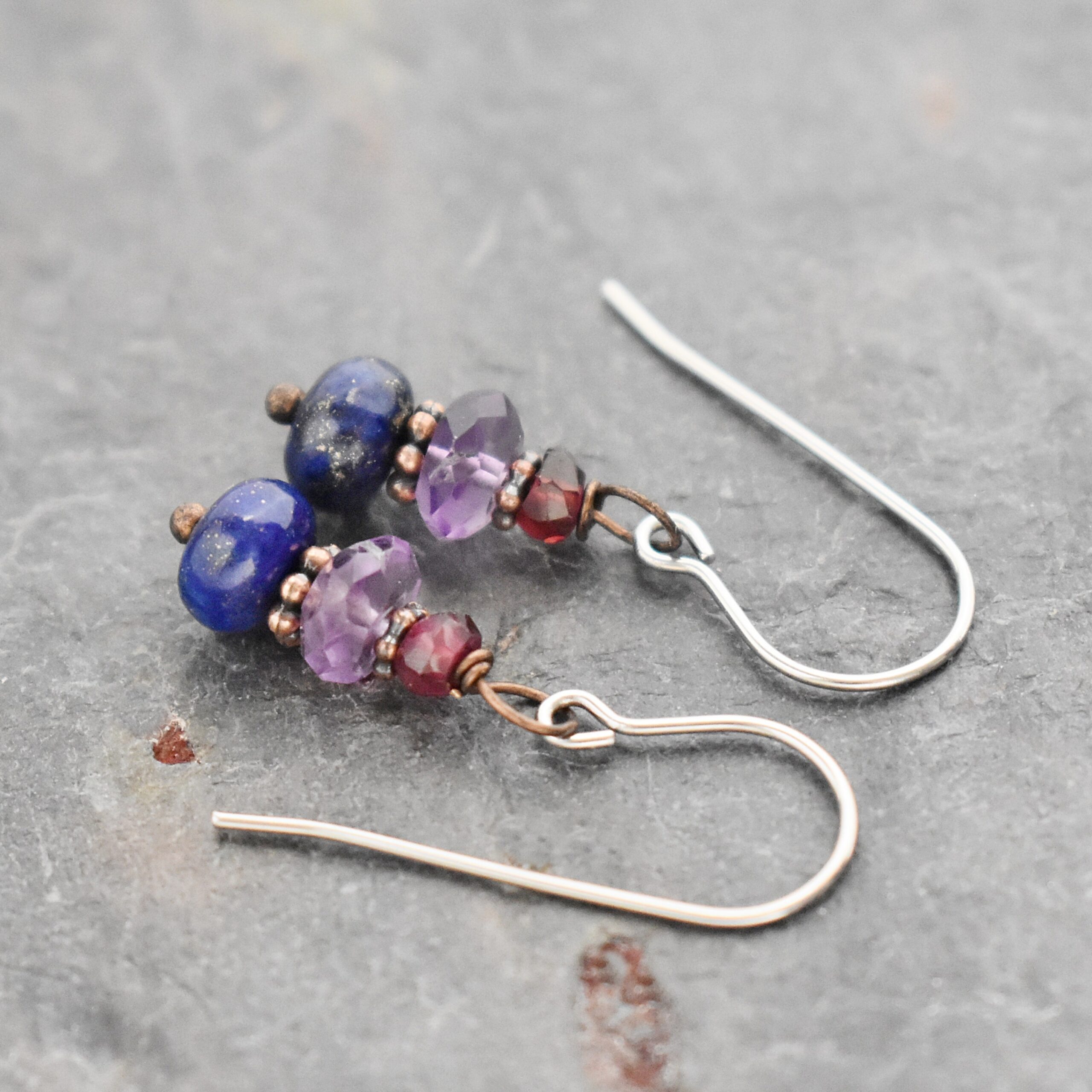 Garnet, Amethyst, Lapis Earrings Handmade gemstone earrings with garnet, purple amethyst and blue lapis stone with copper spacers.