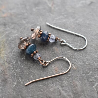 Handmade Tanzanite Sapphire Smoky Quartz Gemstone Earrings Handmade gemstone earrings with lavender blue tanzanite, dark blue sapphire, and brown smoky quartz stones with copper spacers.