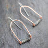 faceted-apatite-copper-earring-detail.jpg Close-up of copper archs with faceted natural apatite stones on surgical steel wire