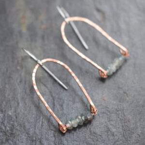Hand-forged copper rainbow apatite dangle earrings on Gray background