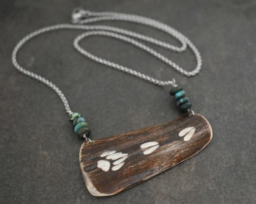 Carved Moose antler with bear moose tracks Carved Moose antler with bear moose tracks