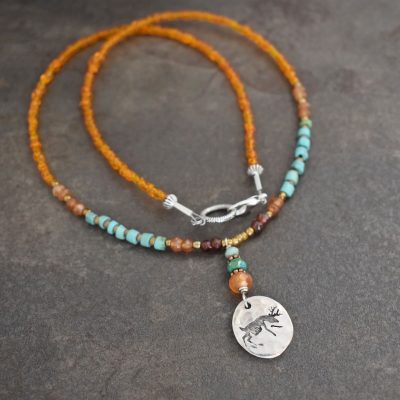 Beaded Deer Necklace beaded deer necklace in orange and turquoise beads