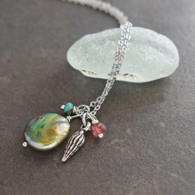 Wentletrap seashell with green coin pearl and gemstone pendant Wentletrap seashell with green coin pearl and gemstone pendant