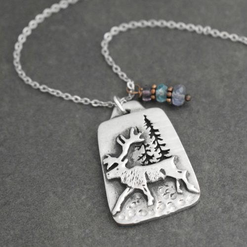 Pewter caribou with iolite, quartz and tanzanite Pewter caribou with iolite, quartz and tanzanite