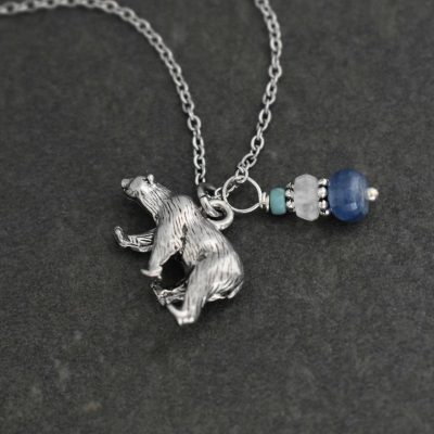 Polar bear pendant wwith turquoise, moostone and kyanite Polar bear pendant wwith turquoise, moostone and kyanite