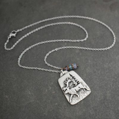 pewter caribou with tanzanite gemstone pewter caribou with tanzanite gemstone